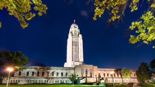 The Nebraska State Capitol tower in Lincoln at dusk