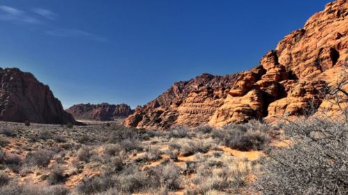 Red rock cliffs and sand trails in Snow Canyon State Park near St. George
